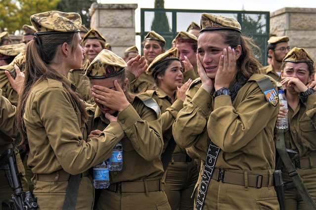 Israeli soldiers mourn during the funeral of Sgt. Lia Ben Nun, 19, in Rishon Lezion, Israel, Sunday, June 4, 2023. The Israeli army says Ben Nun was among three soldiers who were killed by an Egyptian border guard who crossed into Israel on Saturday before he was fatally shot by troops. (Photo by Ohad Zwigenberg/AP Photo)