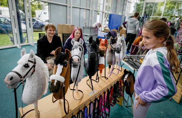 A vendor offers hobby horses for sale at the first German Hobby Horsing Championship in Frankfurt, Germany, Saturday, September 14, 2024. (Photo by Michael Probst/AP Photo)