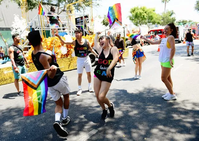 Participants dance at the City of West Hollywood's Pride Parade on June 05, 2022 in West Hollywood, California. (Photo by Chelsea Guglielmino/Getty Images)