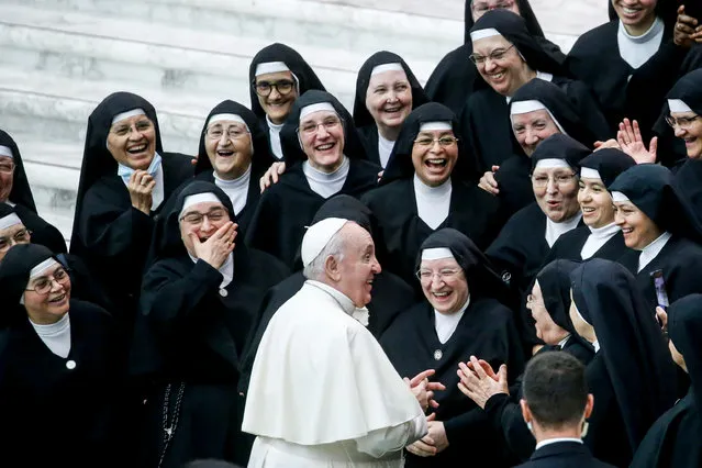 Pope Francis greets a group of nuns during his weekly General Audience in the Paul VI Audience Hall, in Vatican City, 20 October​ 2021. (Photo by Fabio Frustaci/EPA/EFE)
