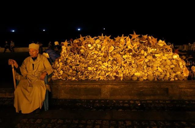 A vendor waits for customers alongside seashells and marine sculptures in front of a maritime museum at the Citadel of Qaitbay on the Mediterranean sea, Alexandria, Egypt June 5, 2017. (Photo by Amr Abdallah Dalsh/Reuters)