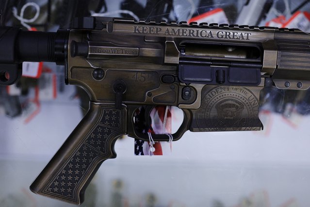 An Auto Ordnance AR-15 rifle commemorating Donald Trump is displayed at Kahr Arms/Tommy Gun Warehouse, which is hosting the Rod of Iron Freedom Festival, in Greeley, Pennsylvania, on October 12, 2024. (Photo by Brian Snyder/Reuters)