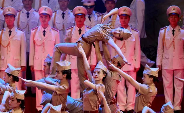 People perform during celebrations to commemorate the 70th anniversary of the establishment of the Vietnam Public Security police force at the National Convention Center in Hanoi August 18, 2015. (Photo by Reuters/Kham)