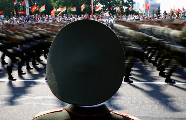 A Belarussian guard of honour stands as he takes part in a military parade during celebrations marking Independence Day in Minsk, Belarus July 3, 2016. Photo taken with long exposure. (Photo by Vasily Fedosenko/Reuters)