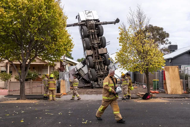 This picture has been selected as one of the Best of the Year News images for 2019* A crane is seen after it collapsed on two houses in Yarraville, Melbourne, Wednesday, April 10, 2019. (Photo by Daniel Pockett/AAP Image)