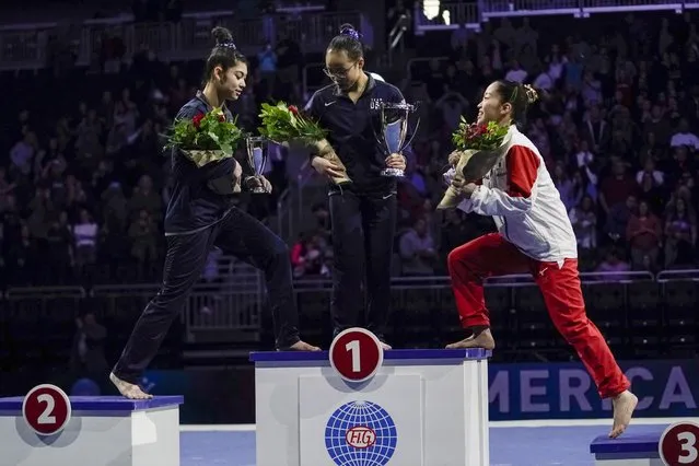 First place all around winner Morgan Hurd of the United States is flanked by second place winner Kayla DiCello of the United States and third place winner Hitomi Hatakeda of Japan after the America Cup gymnastics competition Saturday, March 7, 2020, in Milwaukee. (Photo by Morry Gash/AP Photo)
