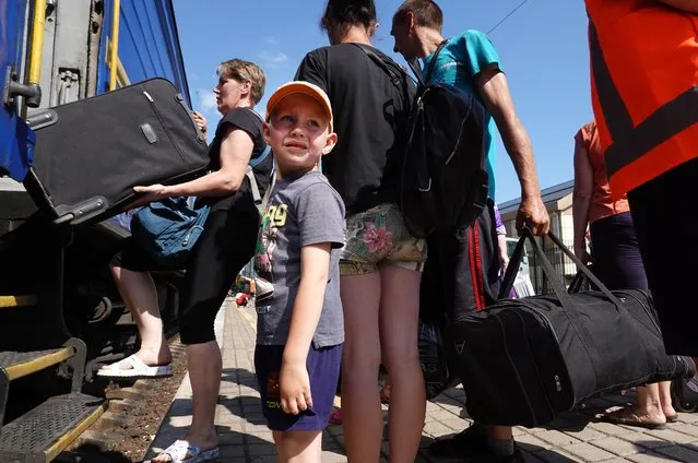 Evacuees trying to escape the war with Russia board a train to Dnipro on June 20, 2022 in Pokrovsk, Ukraine. In recent weeks, Russia has concentrated its firepower on Ukraine's Donbas region, where it has long backed two separatist regions at war with the Ukrainian government since 2014. (Photo by Scott Olson/Getty Images)