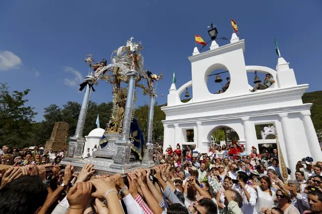 Pilgrims crowd around the Queen of Angeles during a procession in Alajar, southern Spain, September 8, 2015. (Photo by Marcelo del Pozo/Reuters)