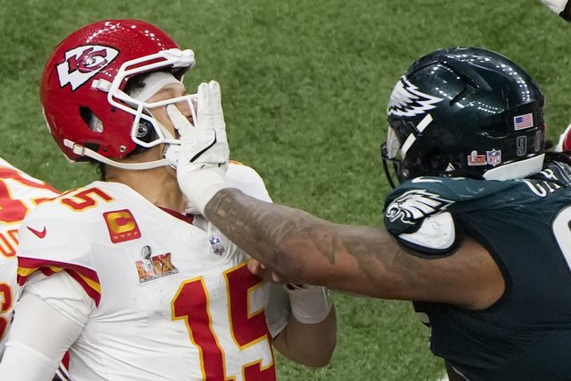 Philadelphia Eagles defensive tackle Jalen Carter (98) pushes Kansas City Chiefs quarterback Patrick Mahomes (15) during the second half of the NFL Super Bowl 59 football game, Sunday, February 9, 2025, in New Orleans. (Photo by Charlie Riedel/AP Photo)