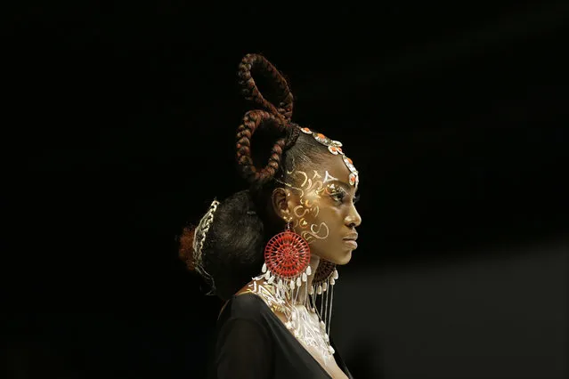 A model displays creations by Maybelline during the Fashion and Design Week in Lagos, Nigeria, Friday, October 27, 2017. (Photo by Sunday Alamba/AP Photo)