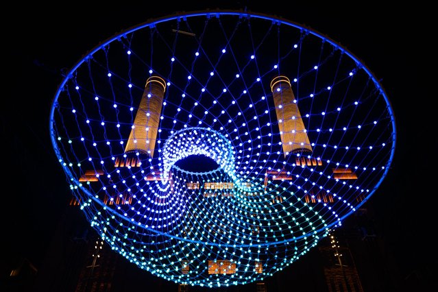 “Parabolic Lightcloud” by Amigo & Amigo illuminates the area as the annual Light Festival opens to the public at Battersea Power station on January 23, 2025 in London, England. The interactive art trail features eight light installations by British and international artists, several making their UK or London debut. (Photo by Leon Neal/Getty Images)