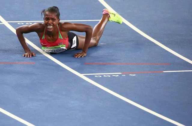 2016 Rio Olympics, Athletics, Final, Women's 1500m Final, Olympic Stadium, Rio de Janeiro, Brazil on August 16, 2016. Faith Chepngetich Kipyegon (KEN) of Kenya reacts on track after winning the final. (Photo by David Gray/Reuters)