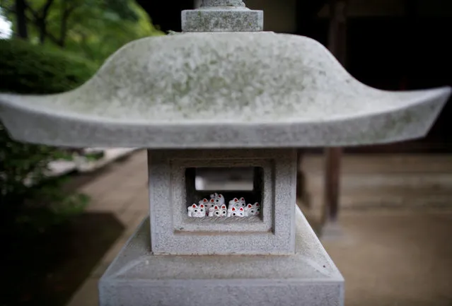 Japanese cat statues called “manekineko”, believed to bring good luck, are dedicated at Gotokuji Temple in Tokyo, Japan August 23, 2017. (Photo by Issei Kato/Reuters)