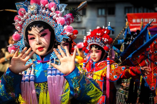Chinese performers dance during the Macau International Parade in Macau on March 23, 2025. (Photo by Eduardo Leal/AFP Photo)