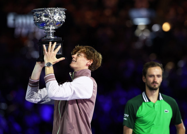 Italy's Jannik Sinner celebrates with the trophy after winning the final against Russia's Daniil Medvedev at the Australian Open in Melbourne on January 28, 2024. (Photo by Eloisa Lopez/Reuters)