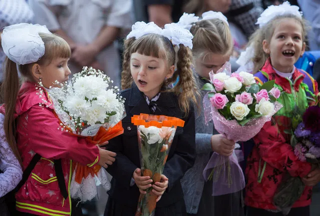 The new school year starts in Russia as 1st grade students attend a ceremony marking Knowledge Day at School 130 in Omsk on September 1, 2016. (Photo by
Dmitry Feoktistov/TASS)
