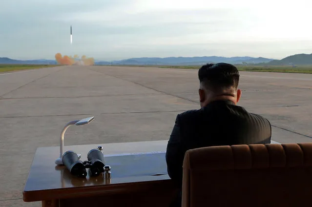 North Korean leader Kim Jong Un watches the launch of a Hwasong-12 missile, September 16, 2017. (Photo by Reuters/KCNA)