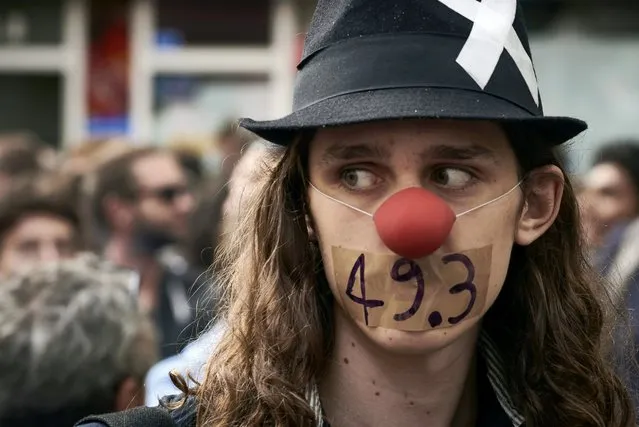 People take part in a demonstration against the French government's labour law reforms, September 15, 2016 in Lyon, France. Opponents of France's controversial labour reforms took to the streets for the 14th time in six months in a last-ditch bid to quash the measures that lost the Socialist government crucial support on the left. (Photo by Jean-Philippe Ksiazek/AFP Photo)