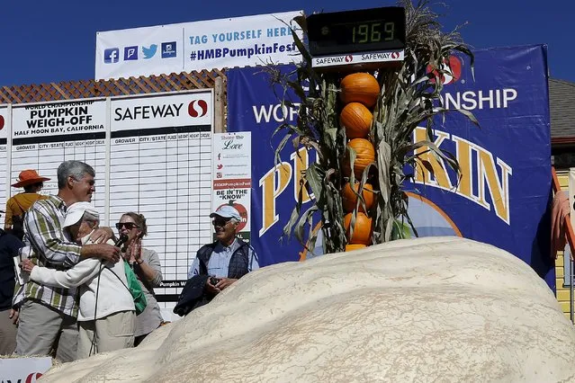 Steve Daletas (L), of Pleasant Hill, Oregon, embraces with mother Jeannette after being declared winner of the 42nd annual Safeway World Championship Pumpkin Weigh-off in Half Moon Bay, California October 12, 2015. (Photo by Stephen Lam/Reuters)