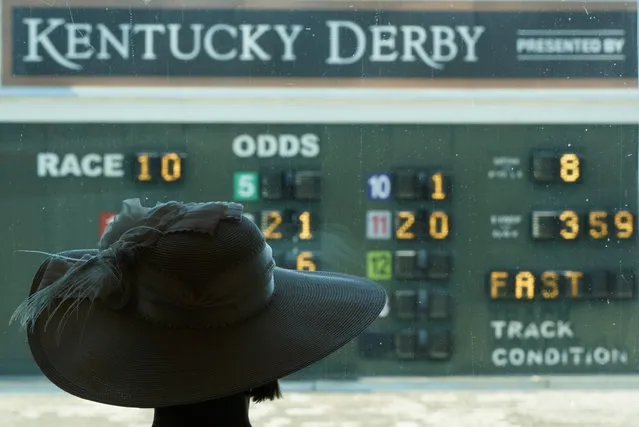 A woman looks out over the paddock before the 146th running of the Kentucky Derby at Churchill Downs, Saturday, September 5, 2020, in Louisville, Ky. (Photo by Charlie Riedel/AP Photo)