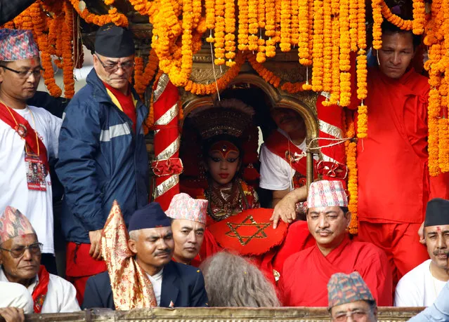 Nepal's living Goddess Kumari sits inside her chariot during the Indra Jatra festival in Kathmandu, Nepal September 15, 2016. (Photo by Navesh Chitrakar/Reuters)