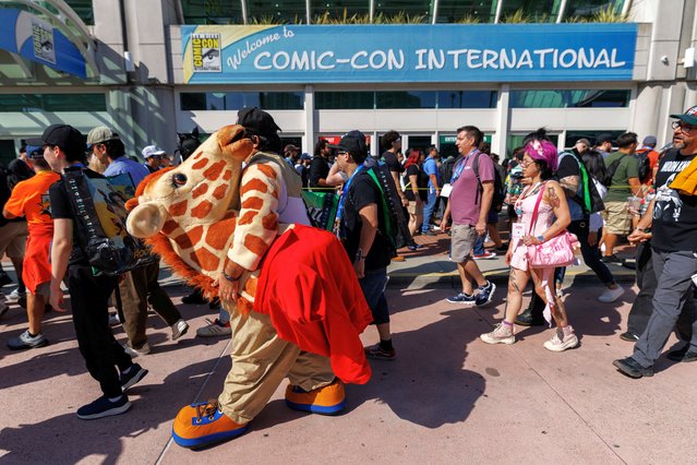 Attendees arrive for the opening day of Comic-Con International in San Diego, California, U.S. July 24, 2025. (Photo by Mike Blake/Reuters)