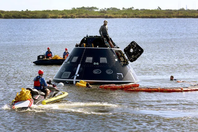 Members of the US Navy and NASA Landing and Recovery Team practice retrieving astronauts from a test version of the Orion capsule on February 06, 2023 in Cape Canaveral, Florida. The recovery team is conducting the tests for when the Orion spacecraft splashes down in the Pacific Ocean starting with the Artemis II mission possibly in 2024. (Photo by Joe Raedle/Getty Images)