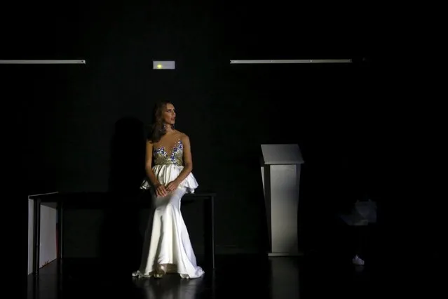 Angela Ponce, 24, sits by herself backstage after being eliminated in the "Miss World Spain" pageant in Estepona, southern Spain,  October 25, 2015. (Photo by Susana Vera/Reuters)
