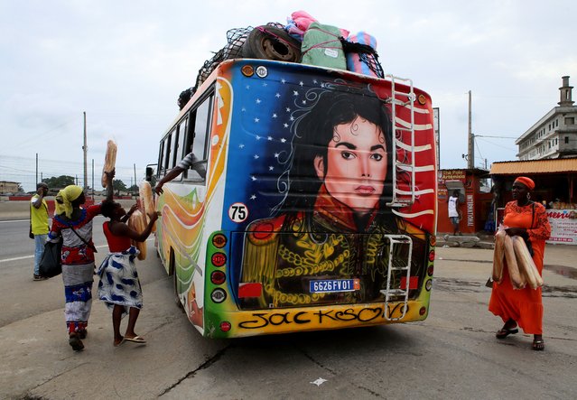 A picture of late US musician Michael Jackson is painted on the back of a bus in Yopougon, a district of Abidjan, Ivory Coast, 12 April 2024. The King of Pop was crowned the real king of a village that he visited during a tour in the Ivory Coast in 1992. Michael Jackson died on 25 June 2009 at the age of 50 in Los Angeles, USA. (Photo by Legnan Koula/EPA)