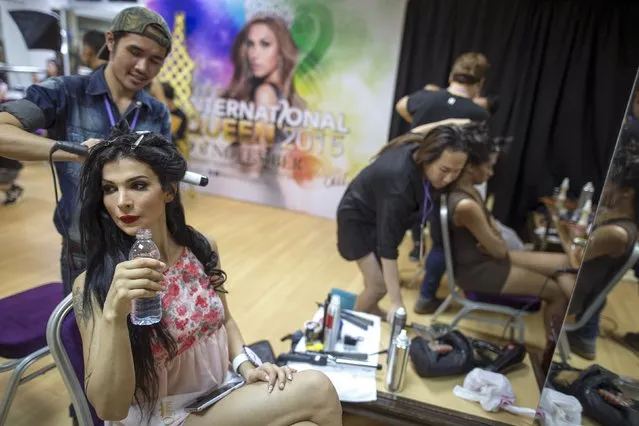 Contestant Kralice Basak (L) of Turkey prepares backstage before the final show of the Miss International Queen 2015 transgender/transsexual beauty pageant in Pattaya, Thailand, November 6, 2015. (Photo by Athit Perawongmetha/Reuters)