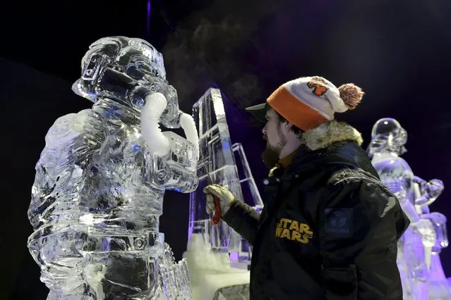 Canada's Alex S. Girard carves a Star Wars character for the ice sculpture festival in Liege, Belgium, November 13, 2015. (Photo by Eric Vidal/Reuters)