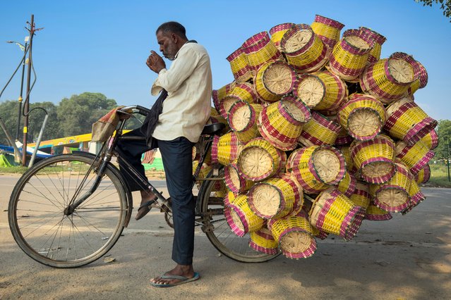 An Indian vendor sells colorful bamboo baskets roadside in Prayagraj, in the northern Indian state of Uttar Pradesh, India, Tuesday, September 30, 2025. (Photo by Rajesh Kumar Singh/AP Photo)