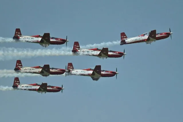 Indonesia's Jupiter Aerobatic Team perform to mark the 77th anniversary of the Indonesian Air Force at the Halim Perdanakusuma Airport in Jakarta on April 9, 2023. (Photo by Adek Berry/AFP Photo)