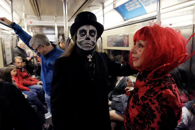 Simon Courtney and Lynne Thurmond ride the subway during Halloween in Manhattan, New York, U.S., October 31, 2016. (Photo by Andrew Kelly/Reuters)