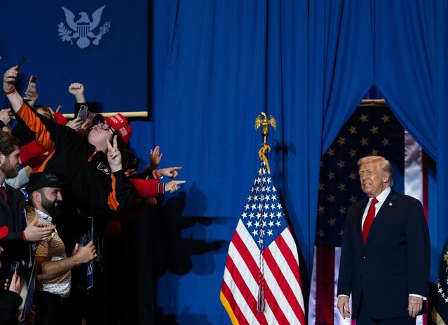 US President Donald Trump looks at the crowd upon his arrival to deliver remarks on the economy at Mount Airy Casino Resort in Mount Pocono, Pennsylvania, on December 9, 2025. (Photo by Andrew Caballero-Reynolds/AFP Photo)