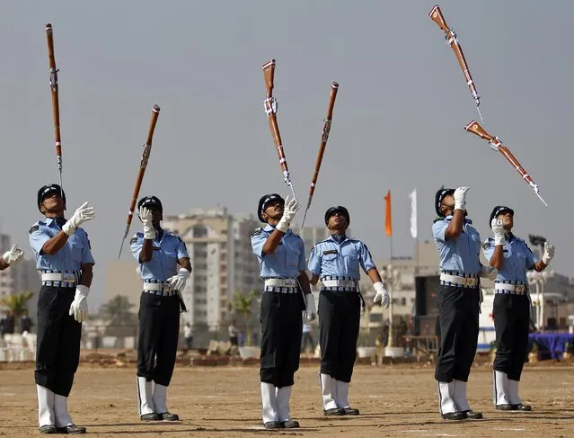 Air Warriors from the Indian Air Force (IAF) perform during an awareness drive in the western Indian city of Ahmedabad, January 17, 2015. (Photo by Amit Dave/Reuters)