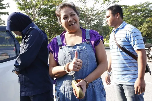 Australian Maria Elvira Pinto Exposto arrives at the magistrates court in Sepang, near Kuala Lumpur, January 23, 2015. She may face the death penalty after she was arrested for carrying crystal methamphetamine into Malaysia, local media reports. (Photo by Olivia Harris/Reuters)