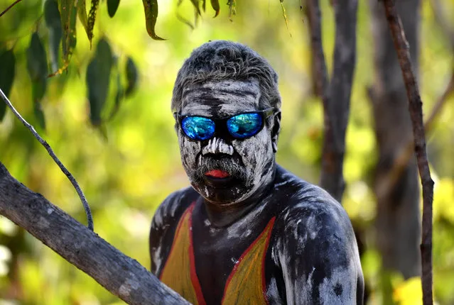 A member from the Gumatj clan of the Yolngu people prepares to perform the Bunggul traditional dance in East Arnhem Land, Australia on August 1, 2018. (Photo by Mick Tsikas/AAP)