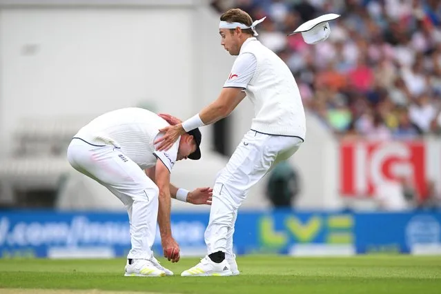 England fielder Stuart Broad looses his sun hat as he runs into James Anderson as they both field the ball during day two of the LV= Insurance Ashes 5th Test Match between England and Australia at The Kia Oval on July 28, 2023 in London, England. (Photo by Stu Forster/Getty Images)