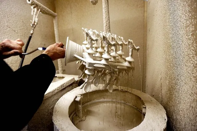 Worker Frank Tildesley works on a form of the “Spirit of Ecstasy”. (Photo by Stefan Wermuth/Reuters)