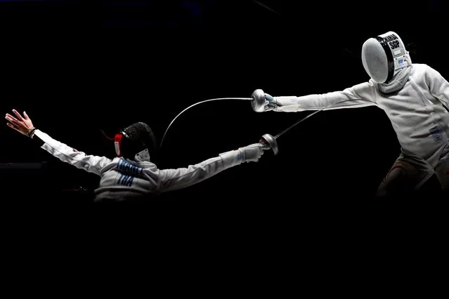 Singapore's Abdul Rahman Kiria Tikanah competes against Thailand's Korawan Thanee at the women's Epee individual table of 32 fencing event during the Hangzhou 2022 Asian Games in Hangzhou, in China's eastern Zhejiang province on September 24, 2023. (Photo by Wang Zhao/AFP Photo)