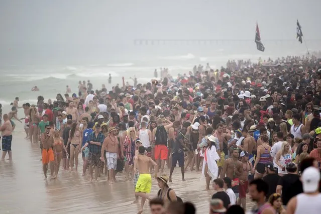 The crowd gathers at the water during spring break festivities in Panama City Beach, Florida March 12, 2015. (Photo by Michael Spooneybarger/Reuters)