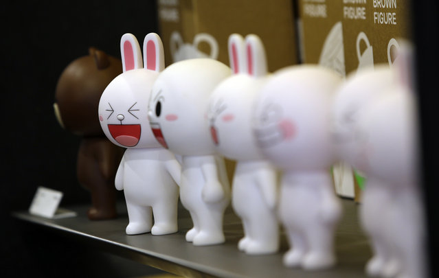In this March 16, 2015 photo, figures of Cony the bunny, one of Line's characters, are displayed at the Line Friends flagship shop  in Seoul, South Korea. For smartphone users in Asia where most of Line's 181 million monthly users are located, the characters are as familiar as Hello Kitty or Disney's animated stars. (Photo by Lee Jin-man/AP Photo)