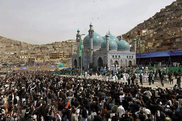 People gather to celebrate Afghan New Year (Newroz) near Sakhi shrine in Kabul March 21, 2015. (Photo by Mohammad Ismail/Reuters)