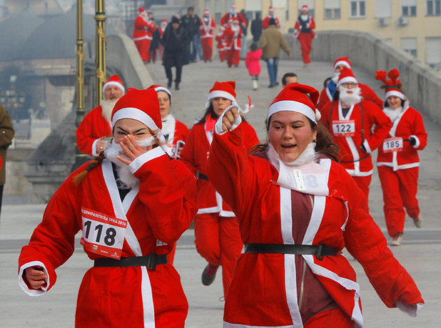 Runners dressed as Santa Claus take part in the annual Christmas race on the streets of Skopje, Macedonia December 25, 2016. (Photo by Ognen Teofilovski/Reuters)