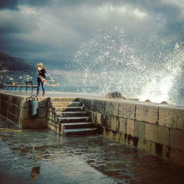 Runner-up. “Dubrovnik old town just after an epic storm. The waves were crashing against the sea walls, and this particular wave caught us all by surprise. I had my phone out and managed to capture this shot before making a hasty retreat”. MICK RYAN, JUDGE: “Some photographers call this a grab shot, a rather demeaning term. I call it seizing the moment, and while not everything is perfect, the overall effect is dramatic”. (Photo by Adrian Travis/The Guardian)