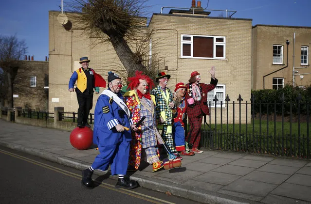 Clowns arrive at the All Saints Church before the Grimaldi clown service in Dalston, north London, February 7, 2016. (Photo by Peter Nicholls/Reuters)