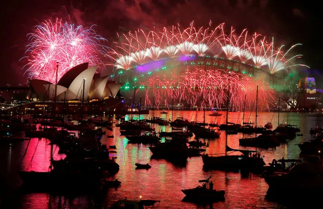 Fireworks explode over the Sydney Opera House and Harbour Bridge as Australia ushers in the New Year in Sydney, January 1, 2017. (Photo by Jason Reed/Reuters)