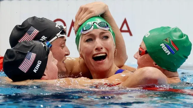 Gold Medalist Tatjana Schoenmaker of South Africa (second from right) celebrates her world record with Silver Medalist Lilly King of USA, Bronze Medalist Annie Lazor of USA, Kalene Corbett of South Africa during the 200m Breaststroke final on day seven of the swimming competition of the Tokyo 2020 Olympic Games at Tokyo Aquatics Centre on July 30, 2021 in Tokyo, Japan. (Photo by Carl Recine/Reuters)