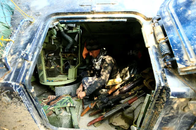 A member of Iraqi rapid response forces sits in a military vehicle during battle with Islamic State militants in the Mithaq district of eastern Mosul, Iraq, January 4, 2017. (Photo by Thaier Al-Sudani/Reuters)